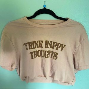 Light Pink shirt that says (think happy thoughts)